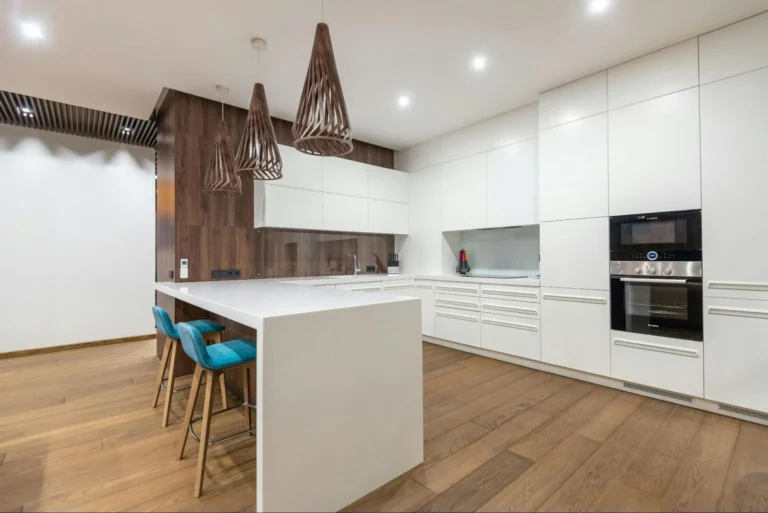 Do you floor under kitchen cabinets